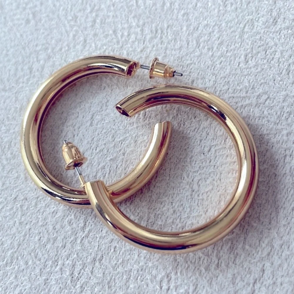 Thick gold hoop earrings